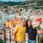 Couple taking a panoramic view of Guanajuato City Mexico