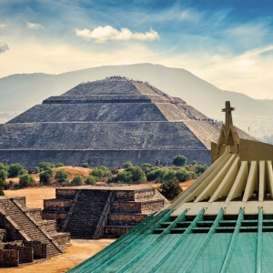 Combo tour featuring the Basilica of Guadalupe in the foreground and the Teotihuacán Sun Pyramid in the background, representing the best half-day tours from Mexico City.
